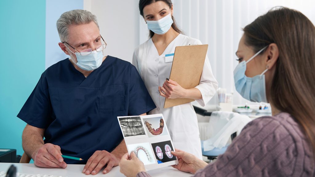 Dentist looking at dental pictures