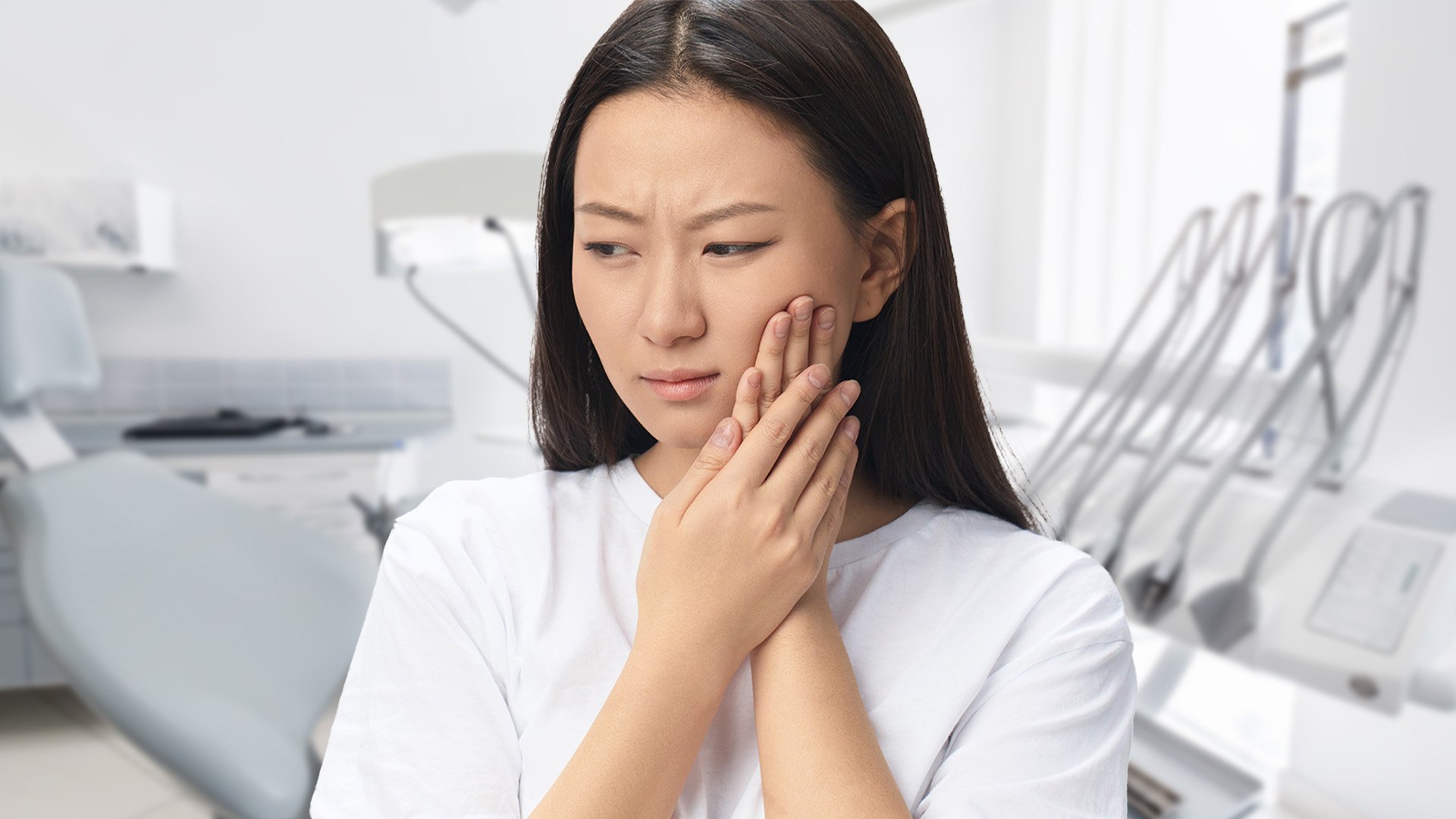 Girl in pain from missing teeth