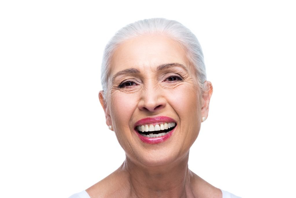 portrait of beautiful smiling senior woman, isolated on white